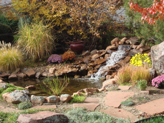Stone Water Feature, Ornamental Planting Beds, Flagstone Path